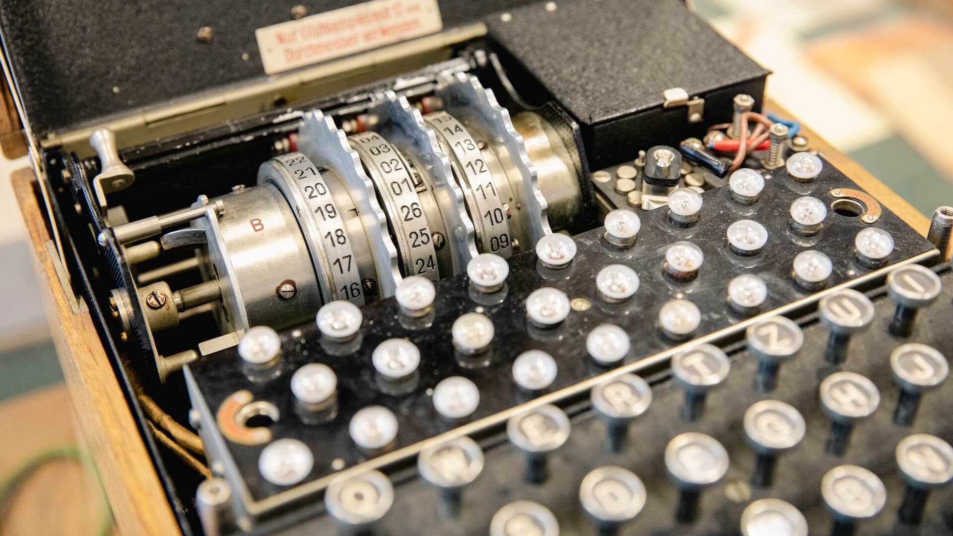 Close-up view of an Enigma machine's intricate mechanical components. Enigma Decryption in WWII
